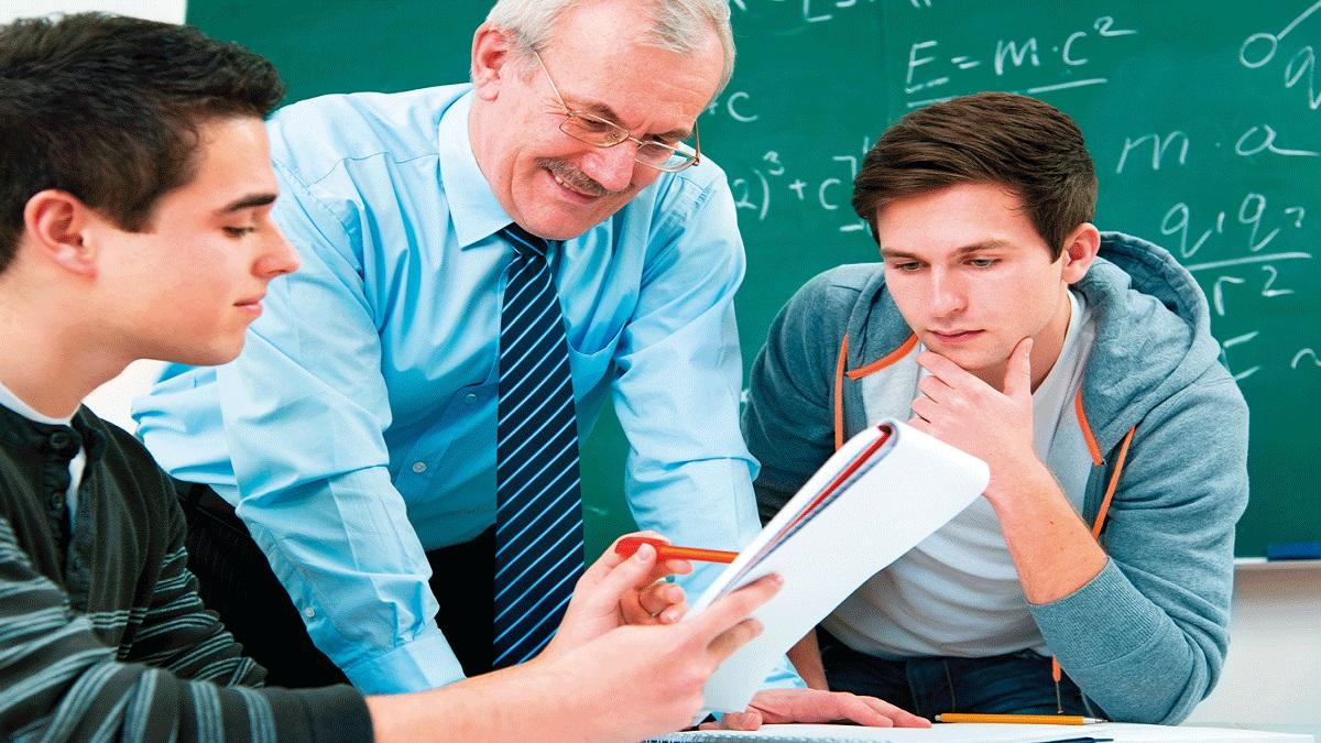 Tutor helping students